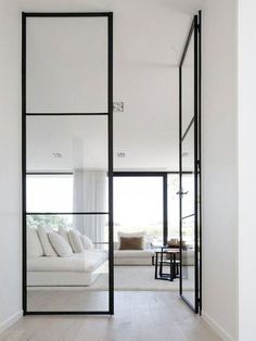 Black door frame on white interiors