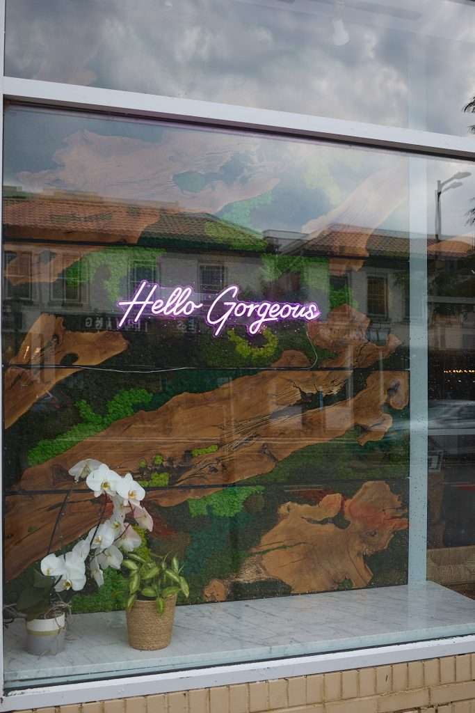 Aurora Spa 1 Window of Aurora Spa in Minneapolis reading "hello gorgeous", Design by Tiffany Hanken Design
