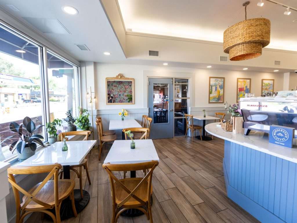 Oh Crêpe! Creperie & Café 28 Bright, modern café interior with seating.