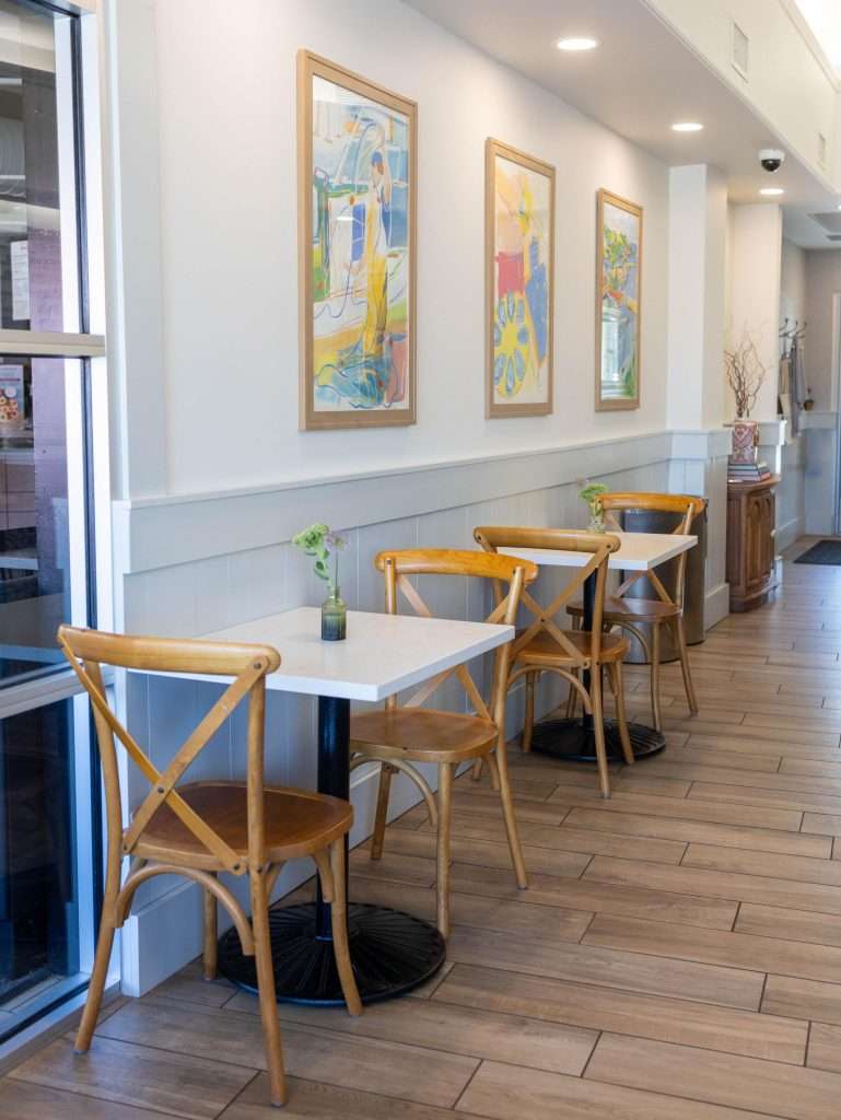 Oh Crêpe! Creperie & Café 25 Cozy cafe with wooden chairs and art