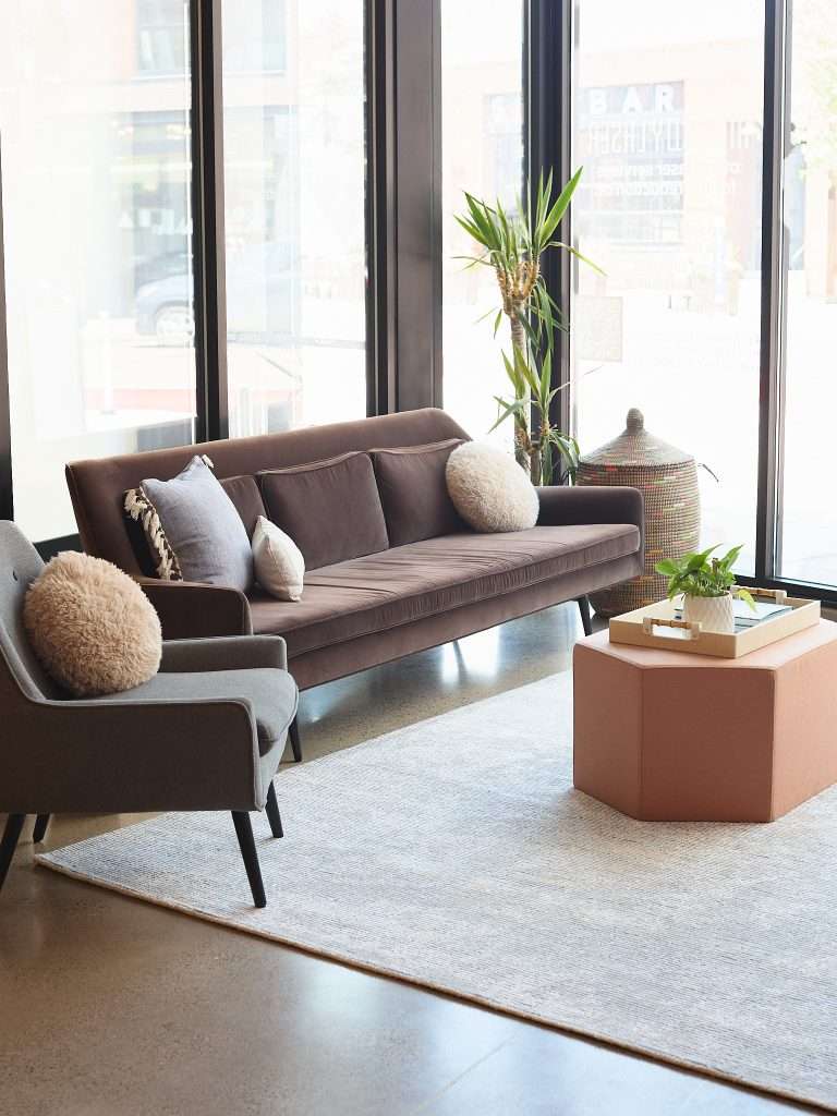 Mill City Laser 9 Elegant brown and grey lounge chairs in window of laser spa