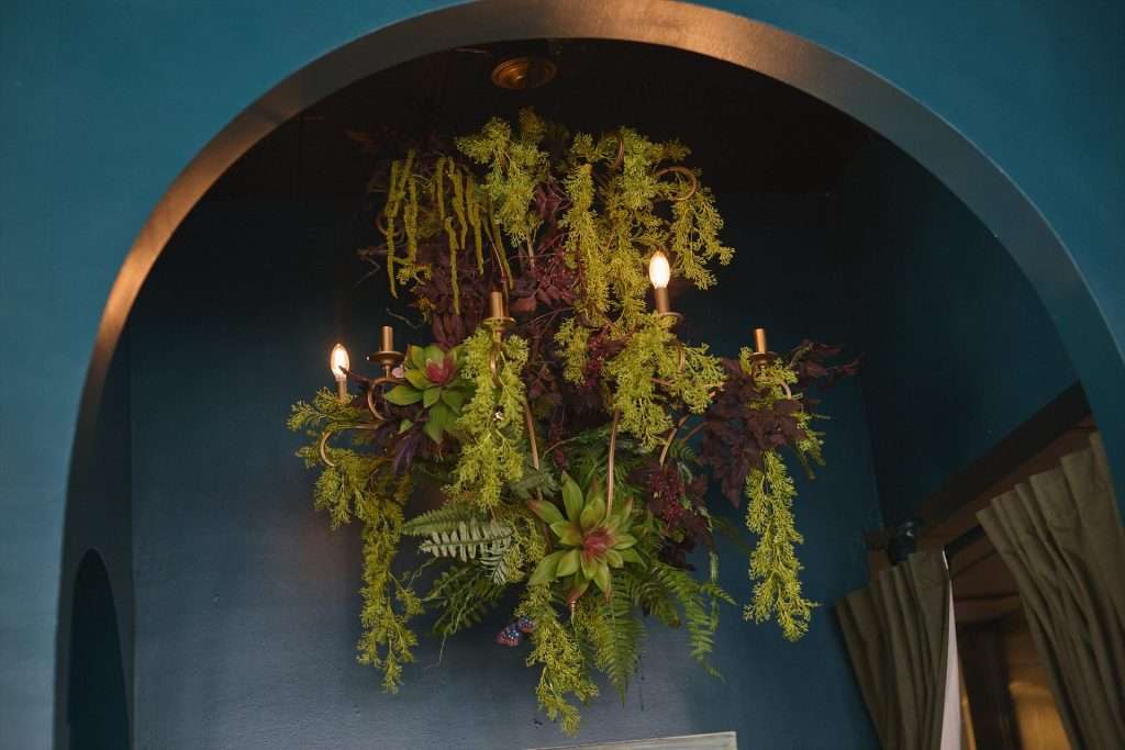 Minneapolis Restaurant Design 20 Floral chandelier in dark archway
