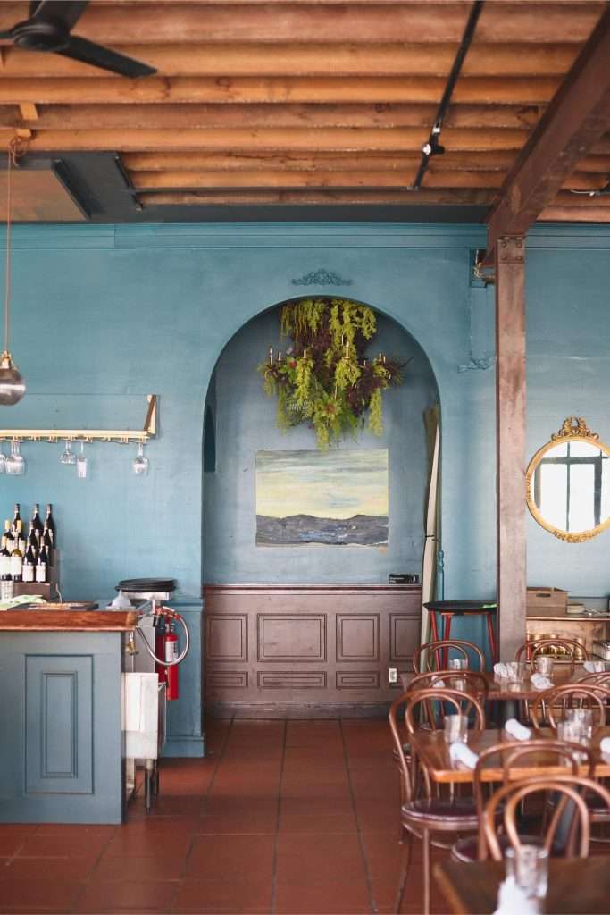 Minneapolis Restaurant Design 19 Cozy restaurant with blue walls, restroom entrance