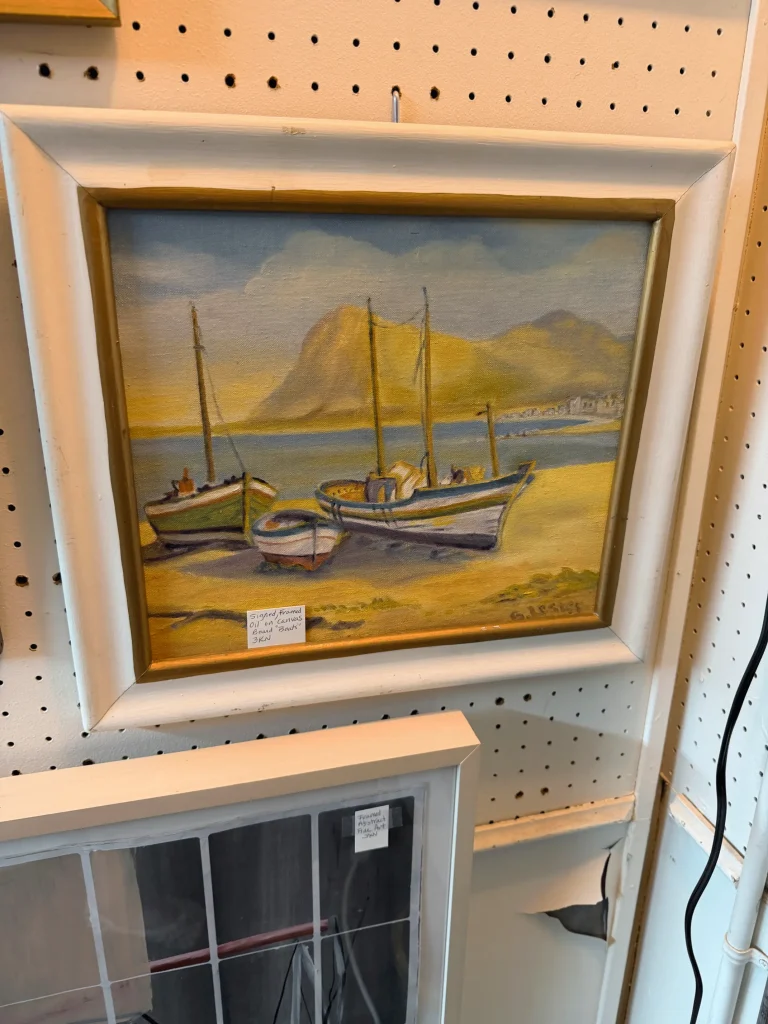 Esther's Table: Bringing a Legendary Minneapolis Hostess Back to the Table 11 Signed vintage oil painting of fishing boats sourced for Esther's Table restaurant interior design