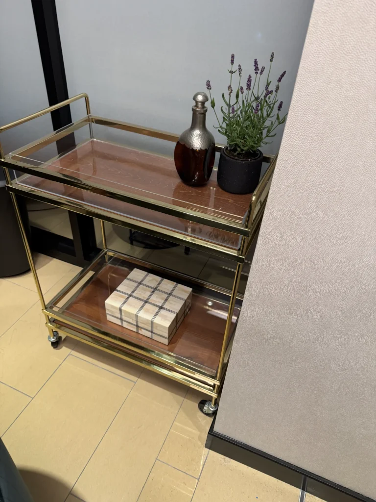 Esther's Table: Restaurant Interior Design, Minneapolis 24 Brass bar cart with vintage hammered-metal decanter, lavender and bone inlay box